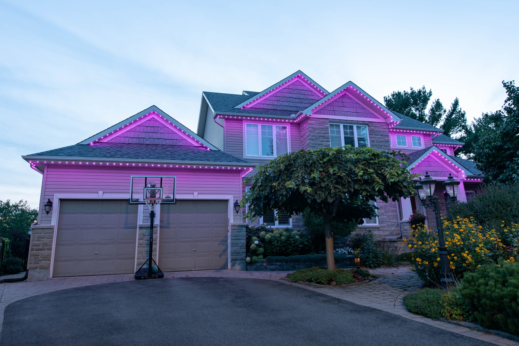 Permanent pink and red permanent lights on a home for Valentine's Day
