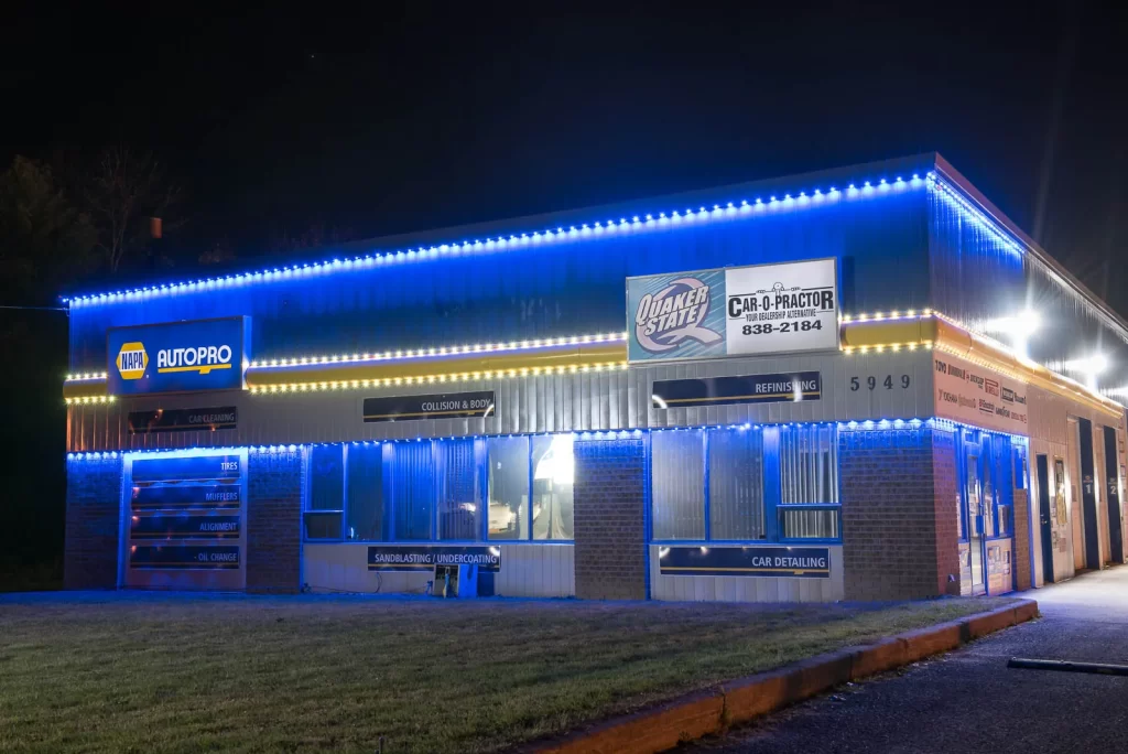 Brilliant By Night lights illuminate auto shop with bold blue lighting